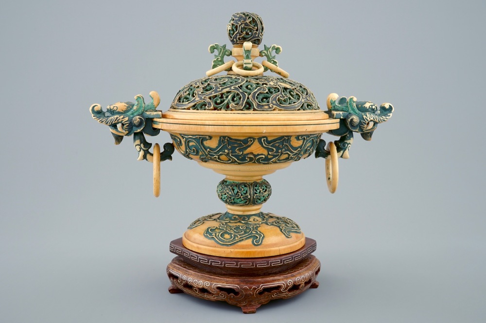 A Chinese polychrome ivory censer with cover on wooden base, 19th C.