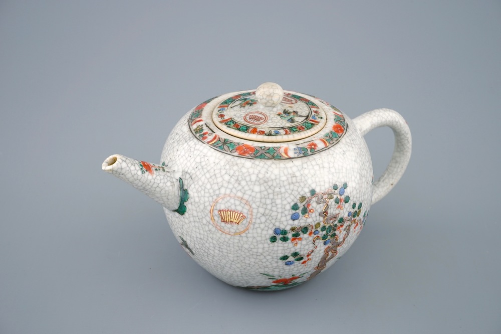 A Chinese famille verte crackle glazed ground teapot and cover, Kangxi