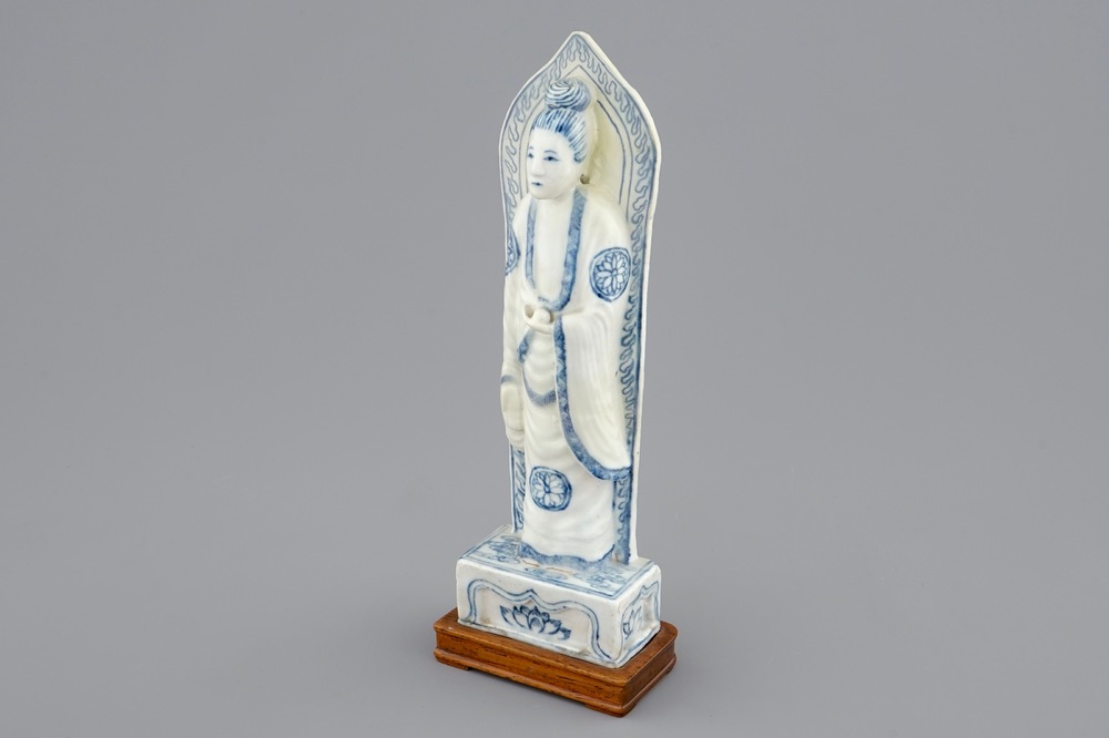 A Chinese blue and white figure of Guanyin on a base, the back inscribed, probably Wanli, Ming Dynasty