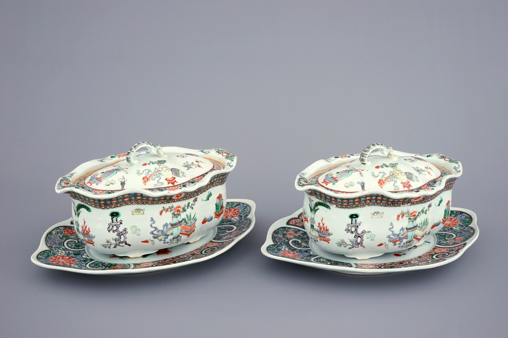 A pair of Chinese famille verte tureens and covers on stands, 19th C.