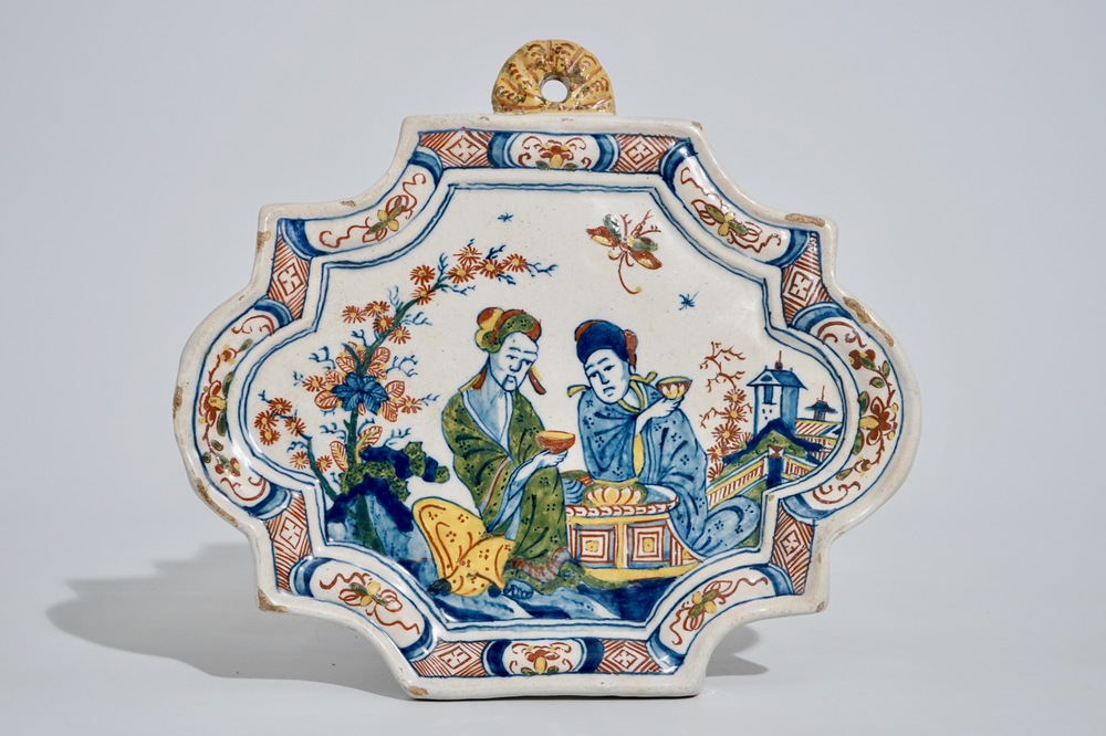 A polychrome Dutch Delft chinoiserie tea scene plaque, 18th C.