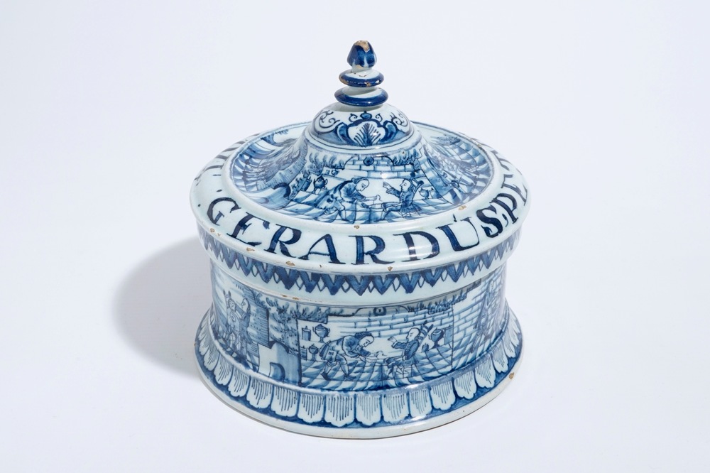 A Dutch Delft blue and white tobacco box and cover with tamper, dated 1763