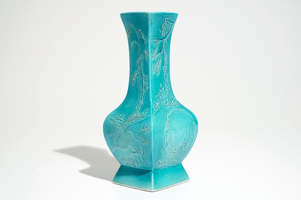 A Chinese turquoise glazed fanghu vase with applied slip design of animals, 19/20th C.