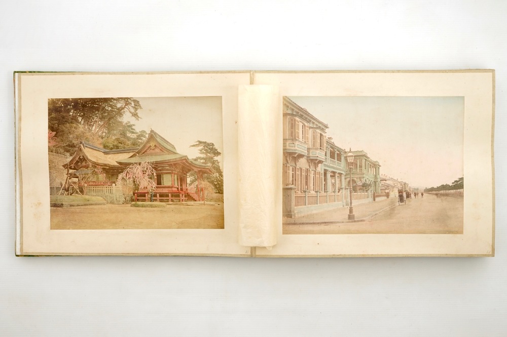 A Japanese photo album with 50 polychrome albumine photos, in original box, 19th C.