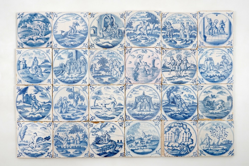 Un lot de 24 carreaux religieux en fa&iuml;ence de Delft bleu et blanc, 18&egrave;me