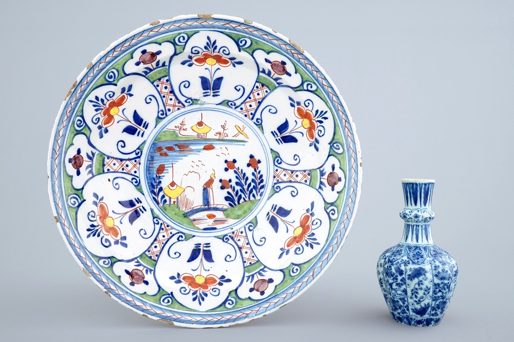 A Dutch Delft blue and white vase and a polychrome dish, 18th C.