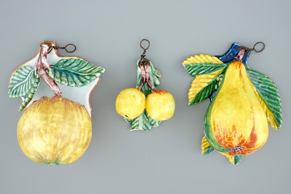 A set of three pieces of polychrome Dutch Delft models of fruit, 19th C.