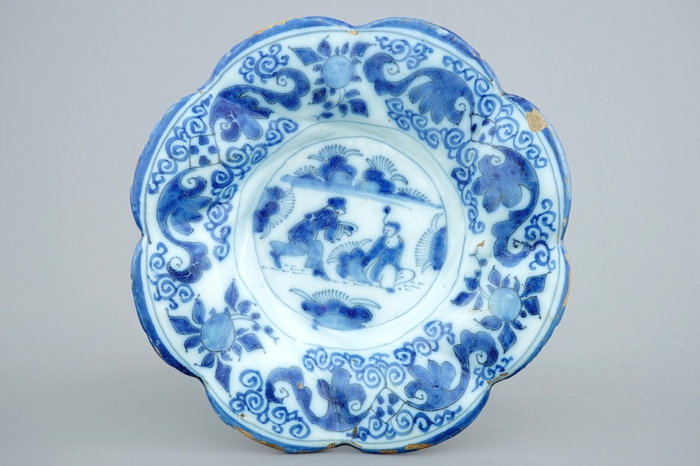 A Dutch Delft blue and white gadrooned chinoiserie dish, 17th C.