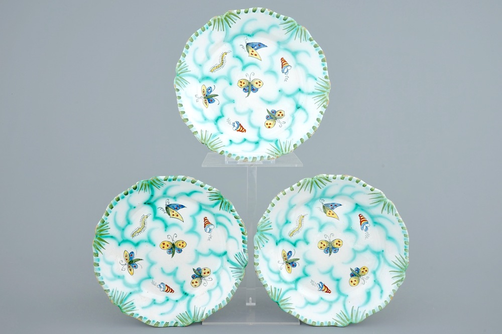 Three Brussels faience plates with butterflies and caterpillars, 18/19th C.