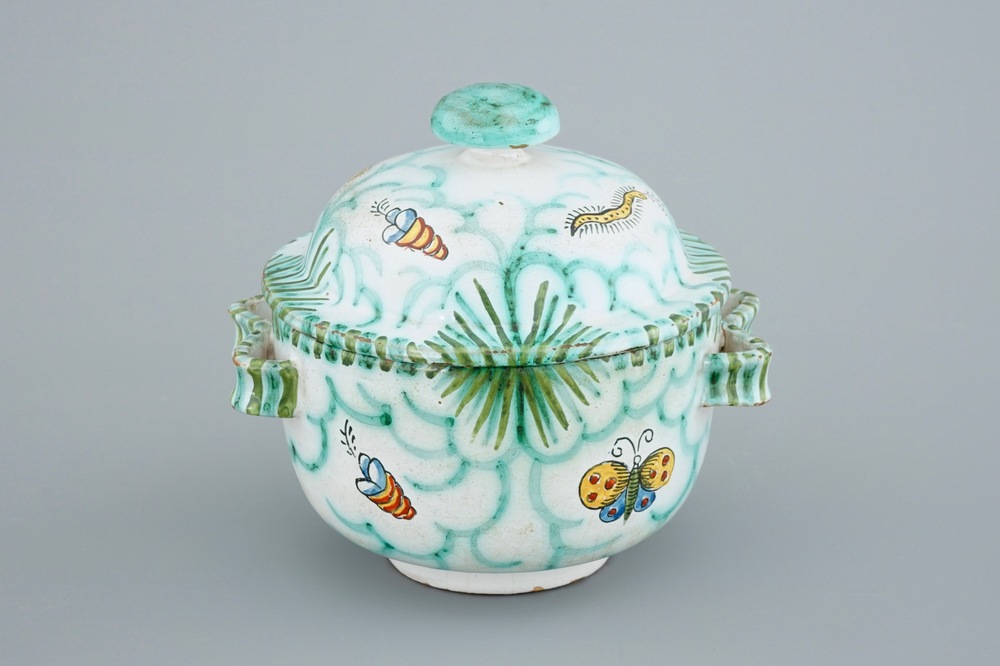 A Brussels faience tureen and cover with butterflies and caterpillars, 18/19th C.