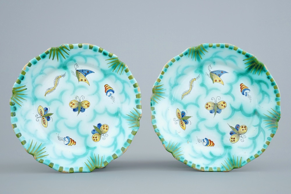 A pair of Brussels faience plates with butterflies and caterpillars, 18/19th C.