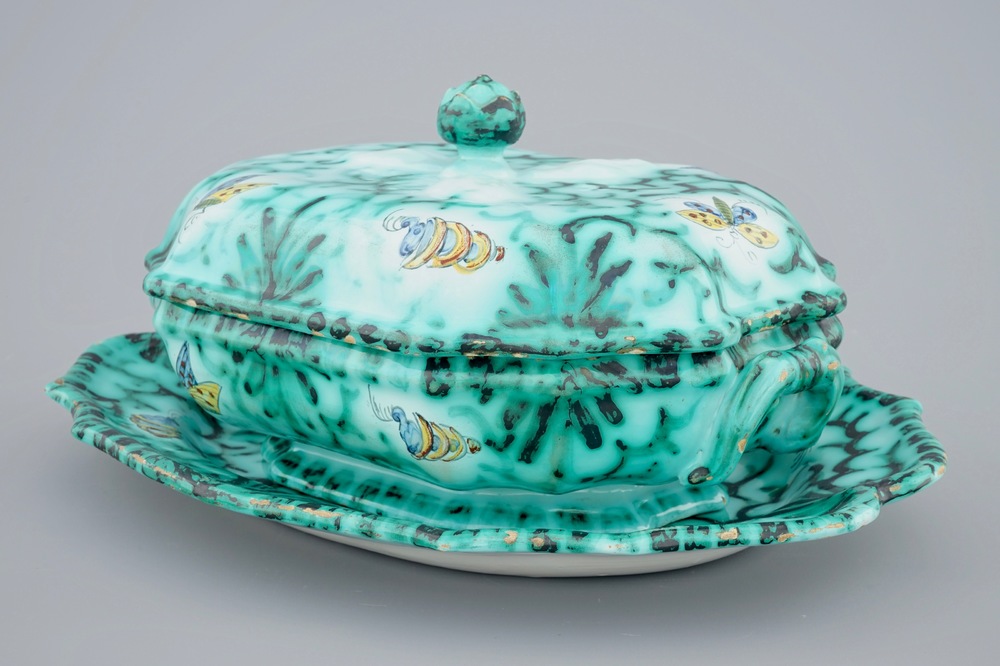 A Brussels faience tureen and cover on stand with butterflies and caterpillars, 18th C.