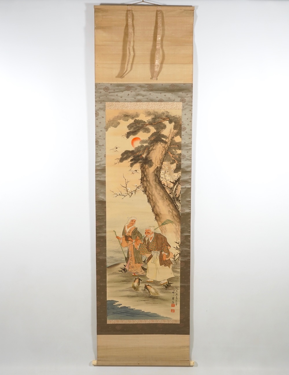 A large Japanese scroll painting in a wooden box, 19/20th C.