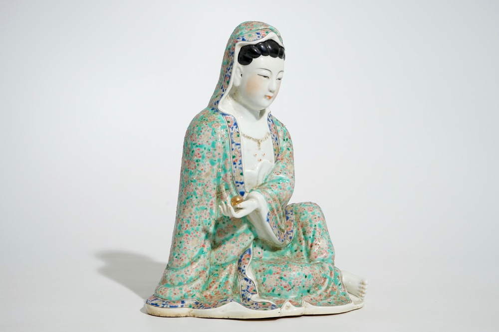 A Chinese famille rose model of a seated Guanyin, 19th C.