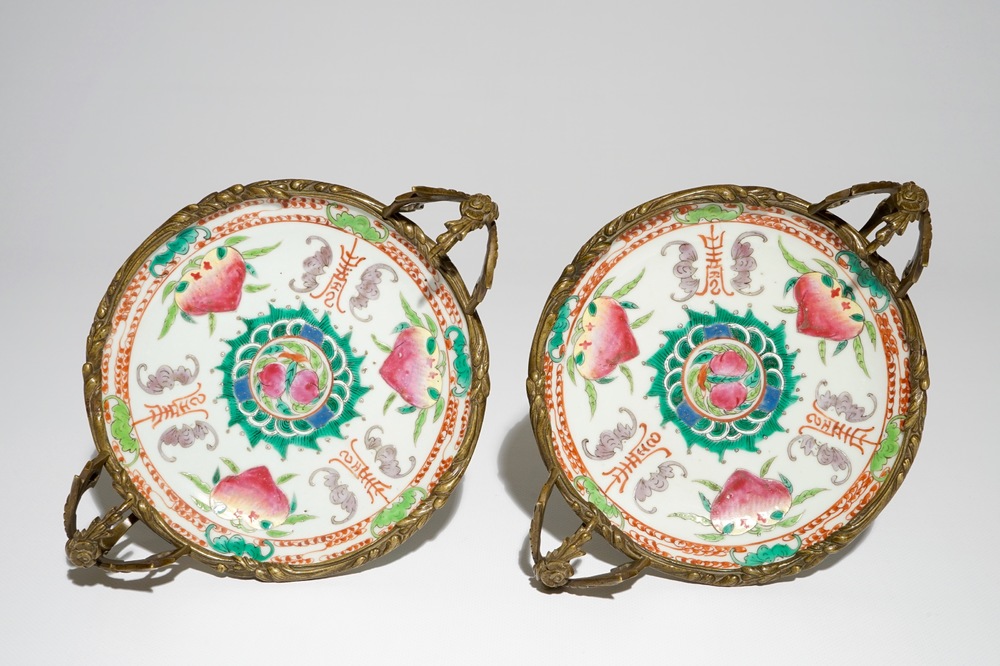 A pair of Chinese bronze-mounted famille rose plates with bats and peaches, Guangxu, 19/20th C.