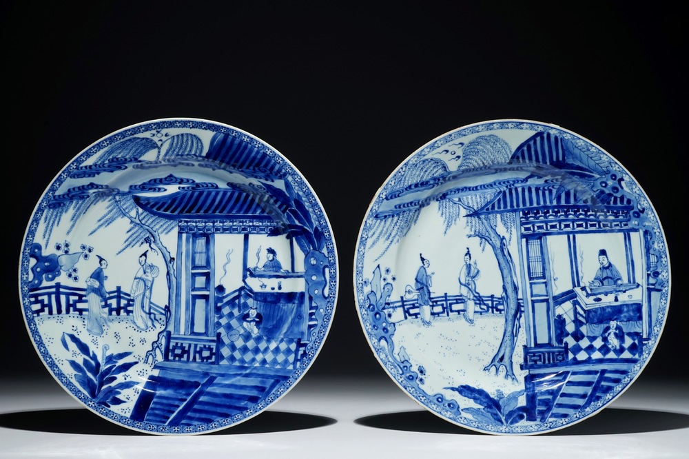 A pair of Chinese blue and white chargers with a scene from &quot;The Romance of the Western Chamber&quot;, Yongzheng
