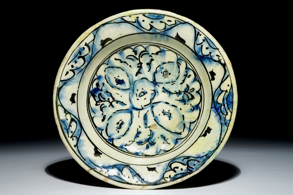 An Iznik pottery dish with blue and black design, Turkey, 17th C.