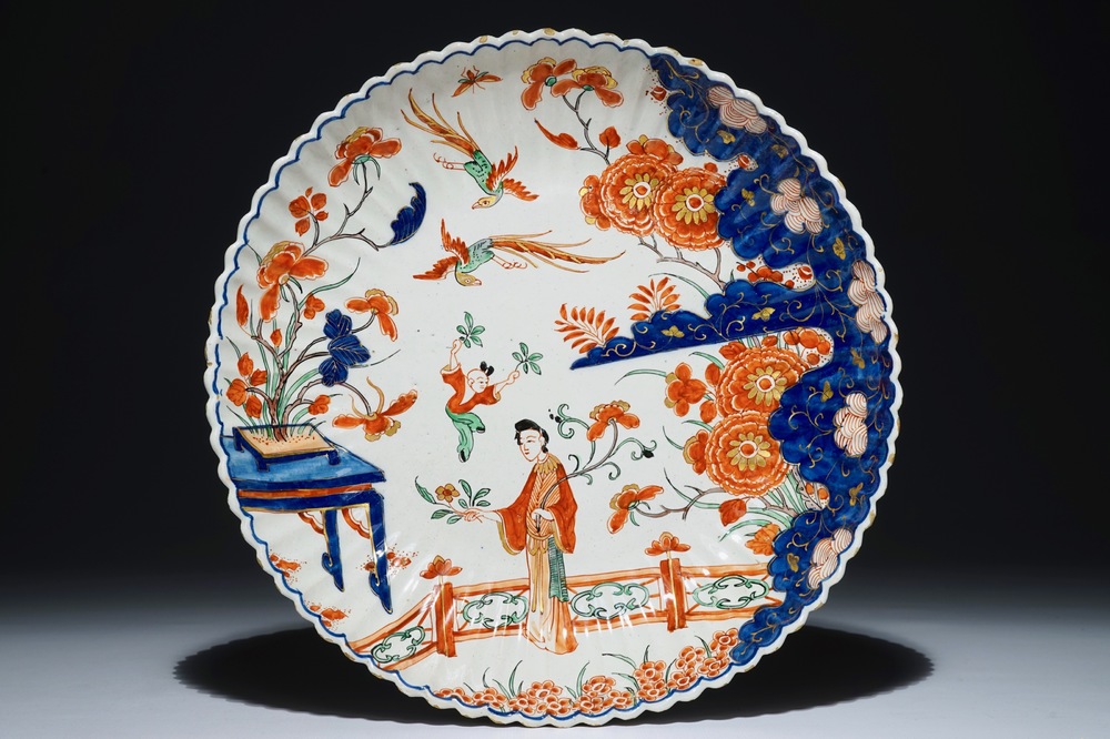A Dutch Delft dor&eacute; gadrooned chinoiserie dish with figures, early 18th C.