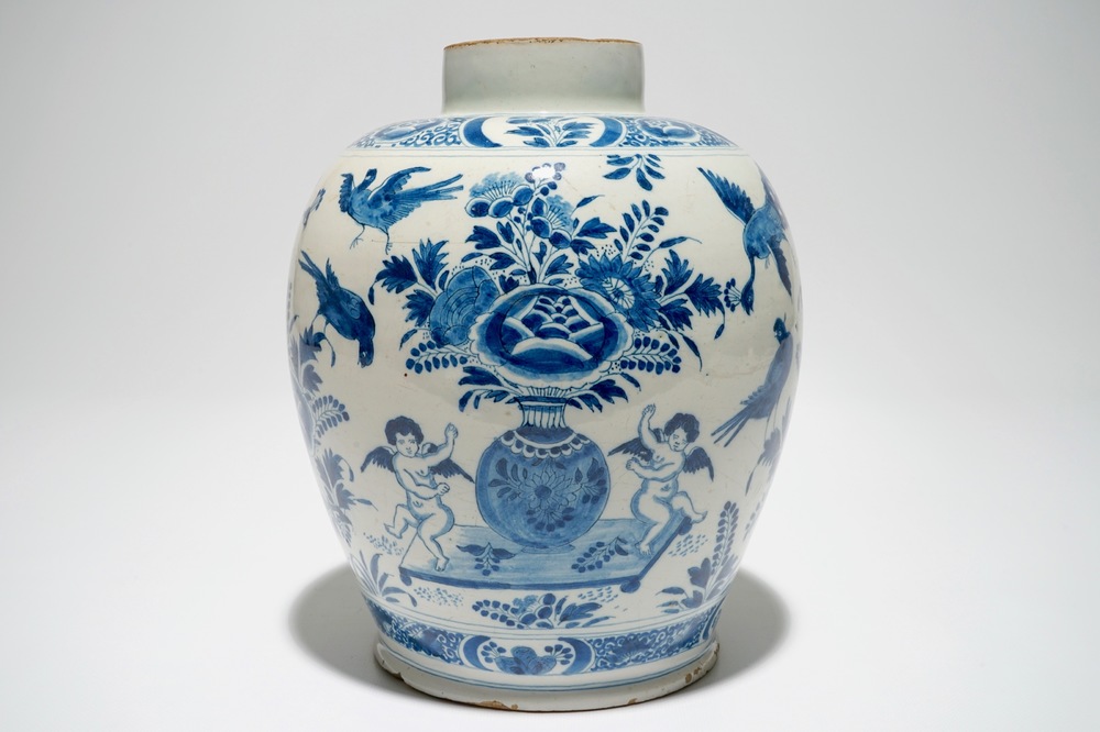 A Dutch Delft blue and white jar with putti design, 18th C.