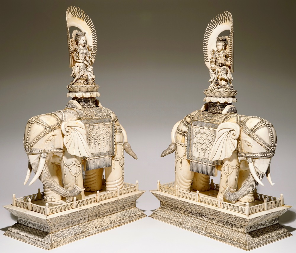 A pair of massive ivory groups of Guanyin seated on an elephants, 19th C.