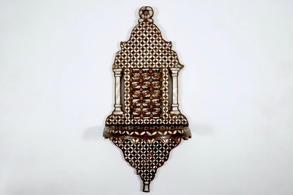 A Syrian wall bracket of wood inlaid with mother of pearl, 19/20th C.