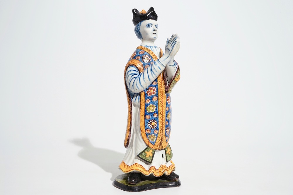 A large Dutch Delft polychrome figure of a standing priest, 18th C.