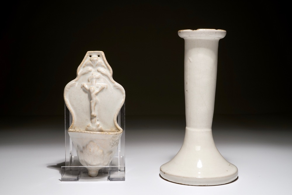 A white Dutch Delft candle stick and a holy water font, 18th C.