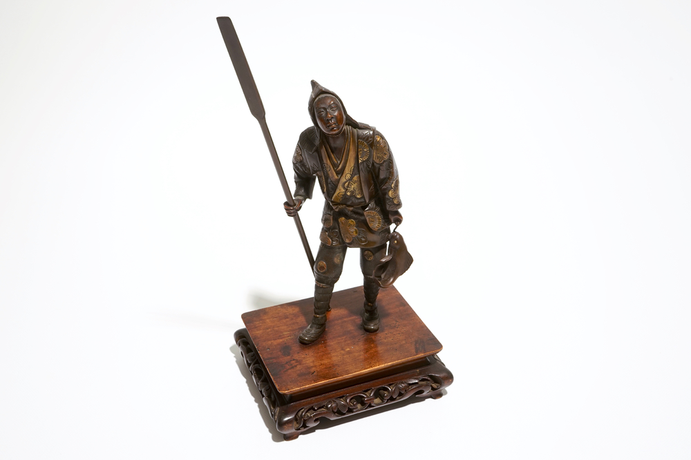 A Japanese bronze figure of a fisherman, signed Miyao, on a wooden stand