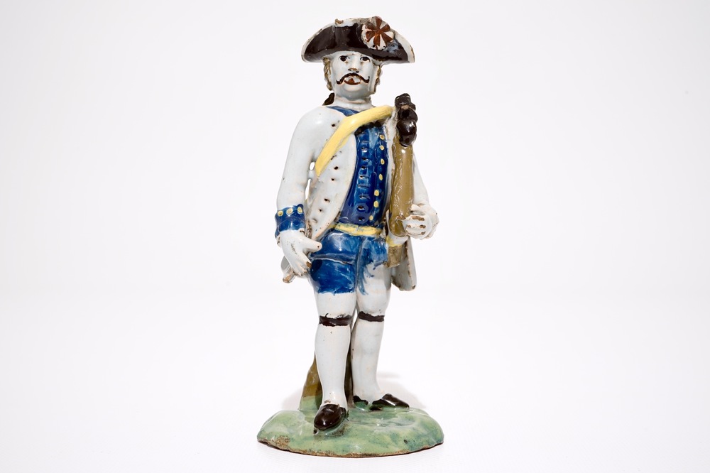 A polychrome pottery figure of a soldier, Brussels or France, 18th C.