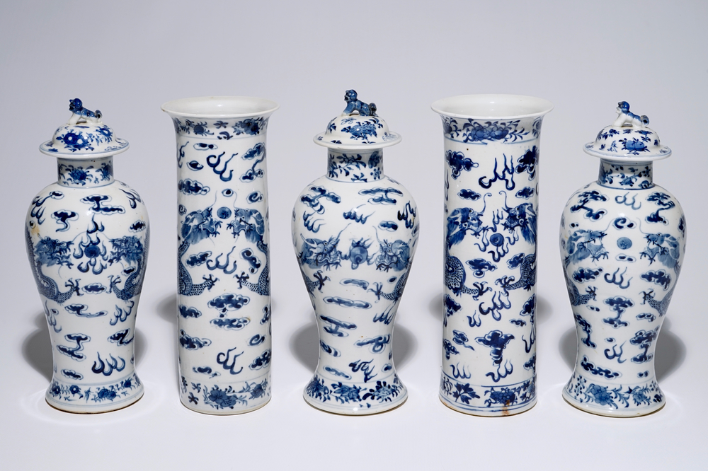 A five-piece Chinese blue and white garniture with dragons, 19th C.