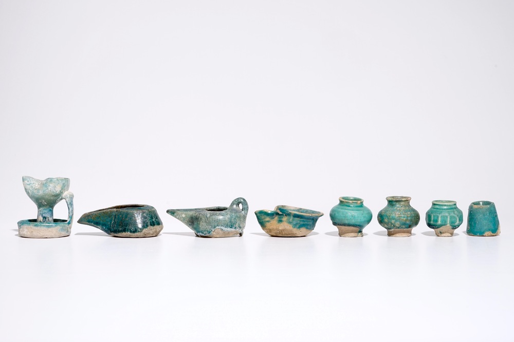 A collection of Islamic turquoise glazed oil lamps, jars and vessels, a.o. Raqqa, 13th C. and later