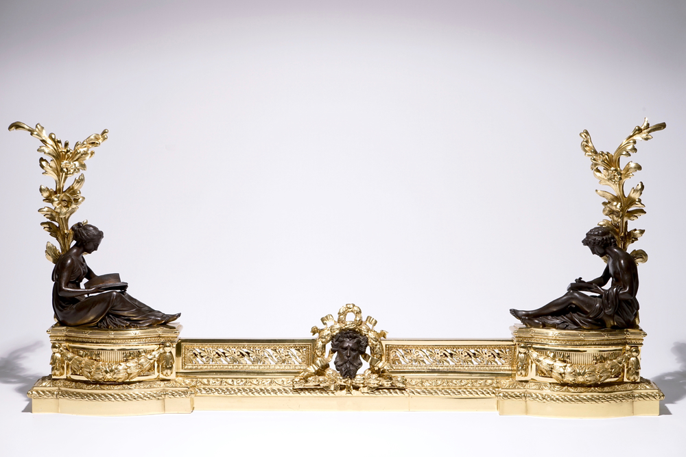 A three-piece patinated and gilt bronze adjustable fireplace fender, France, 19th C.