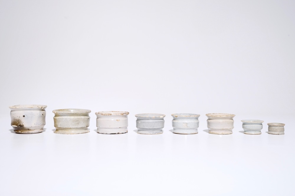 A set of eight white Dutch Delft ointment jars, 17th C.