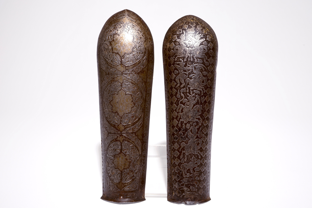 Two engraved and damascened Qajar bazuband arm guards, Iran, 18/19th C.