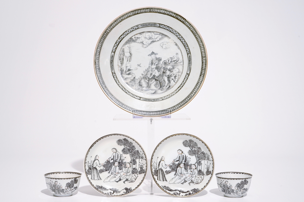 A Chinese grisaille plate with Luohan and a tiger and two cups and saucers, Qianlong