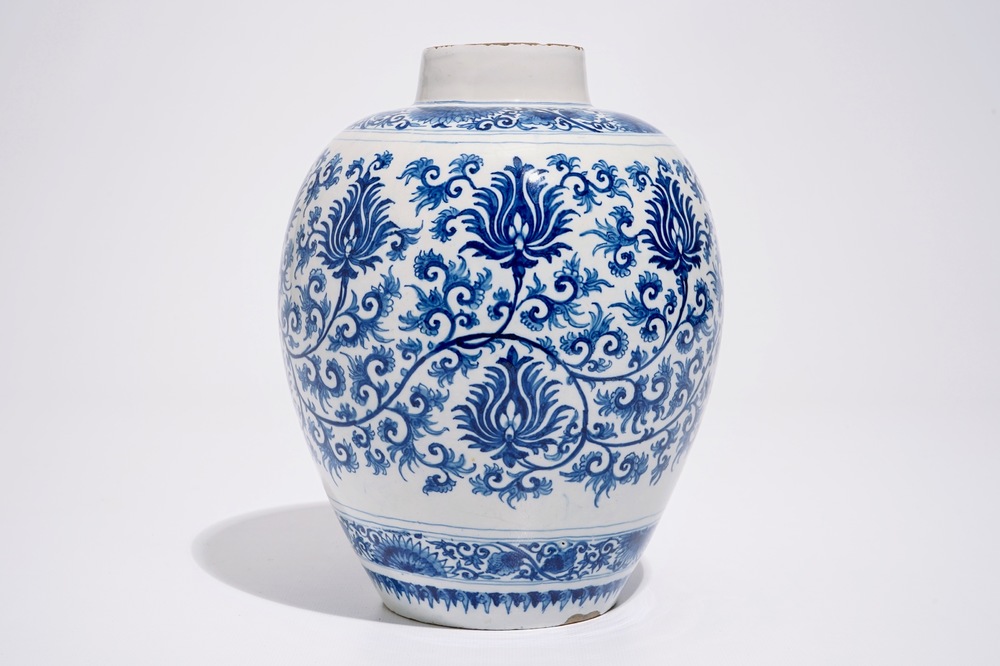 A Dutch Delft blue and white jar with peony scrolls in Ming-style, late 17th C.