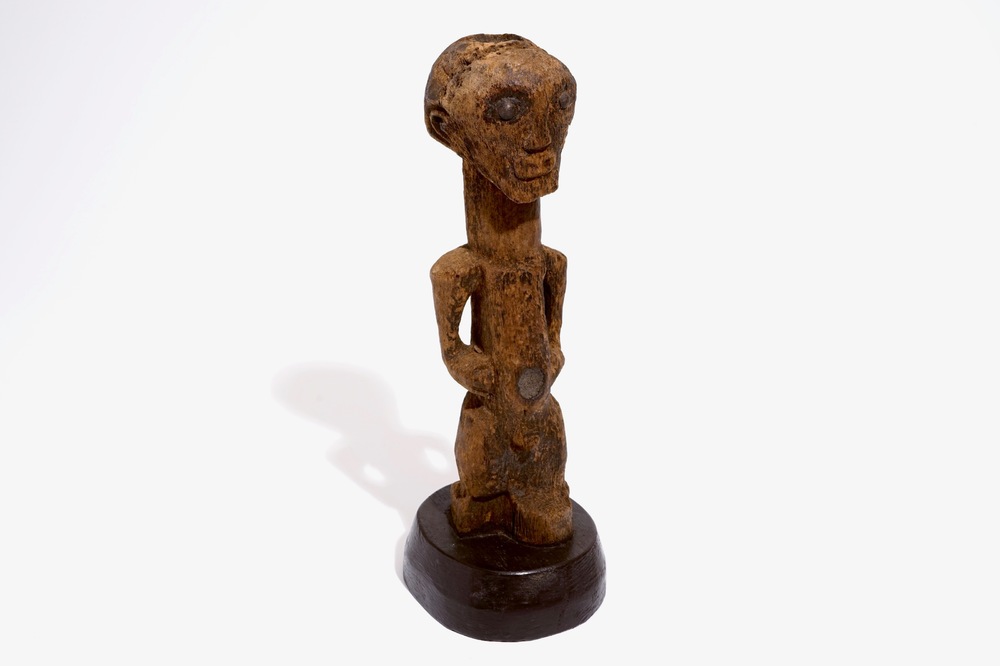 A Songye fetish on wooden base, D.R. Congo, 1st half 20th C.