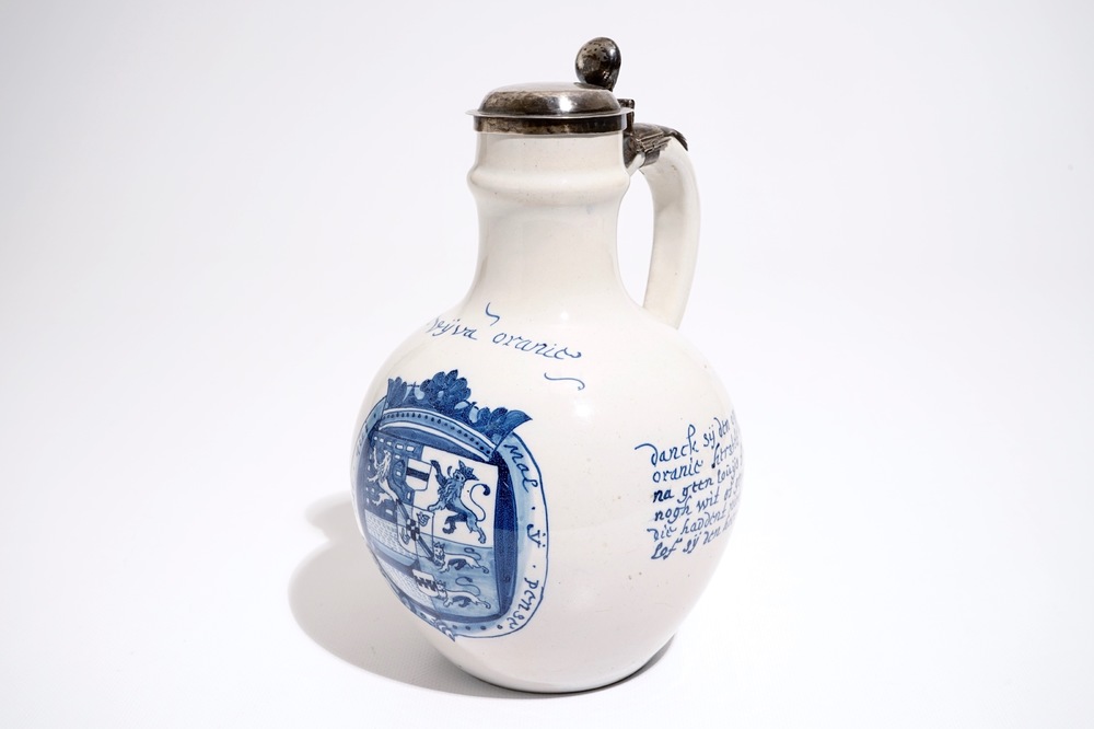 A Dutch Delft orangist text jug with the arms of King William III, 17th C.