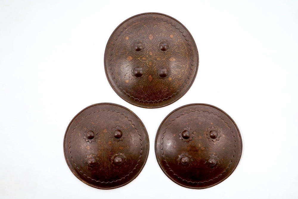 Three round damascened iron shields, Qajar, Iran, 18/19th C.