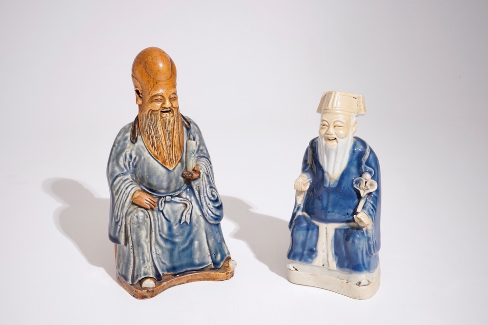 Two Chinese blue and white glazed biscuit figures of immortals, Qianlong