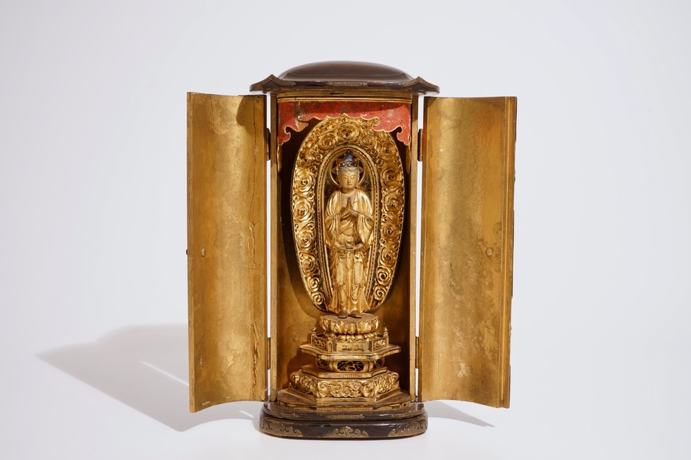 A Japanese lacquered and gilt wood &quot;Zushi&quot; shrine with a standing Buddha on a lotus throne, Edo, 17/18th C.