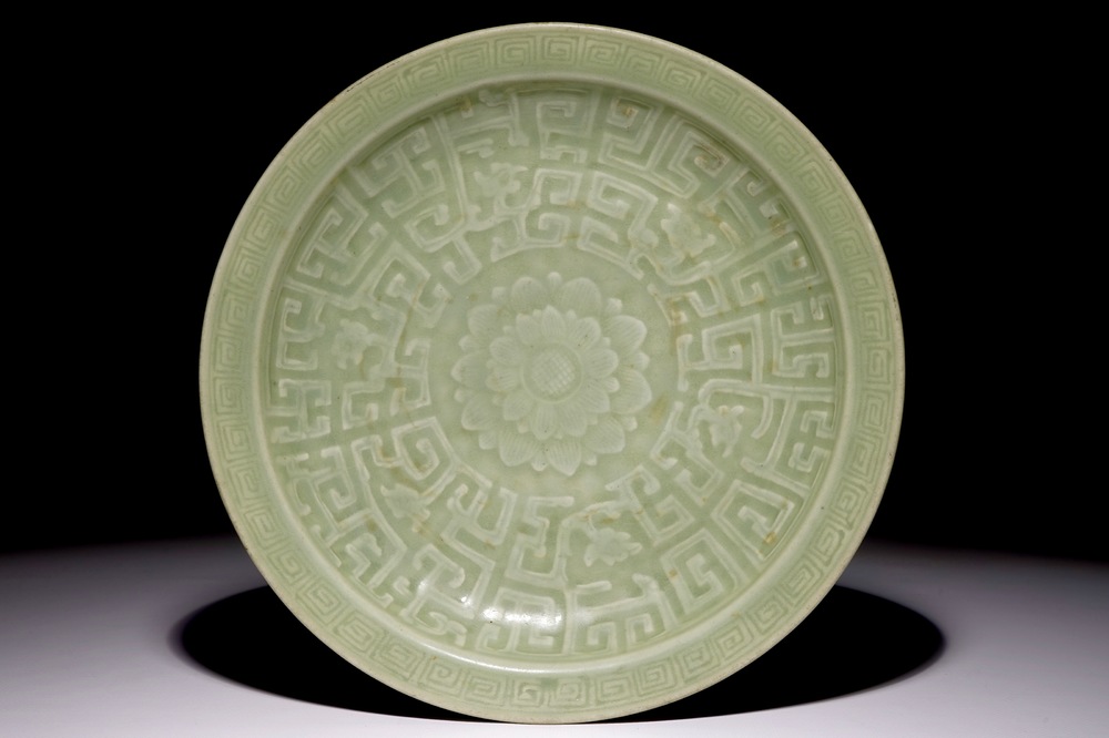 A Chinese celadon dish with incised lotus design, 19th C.