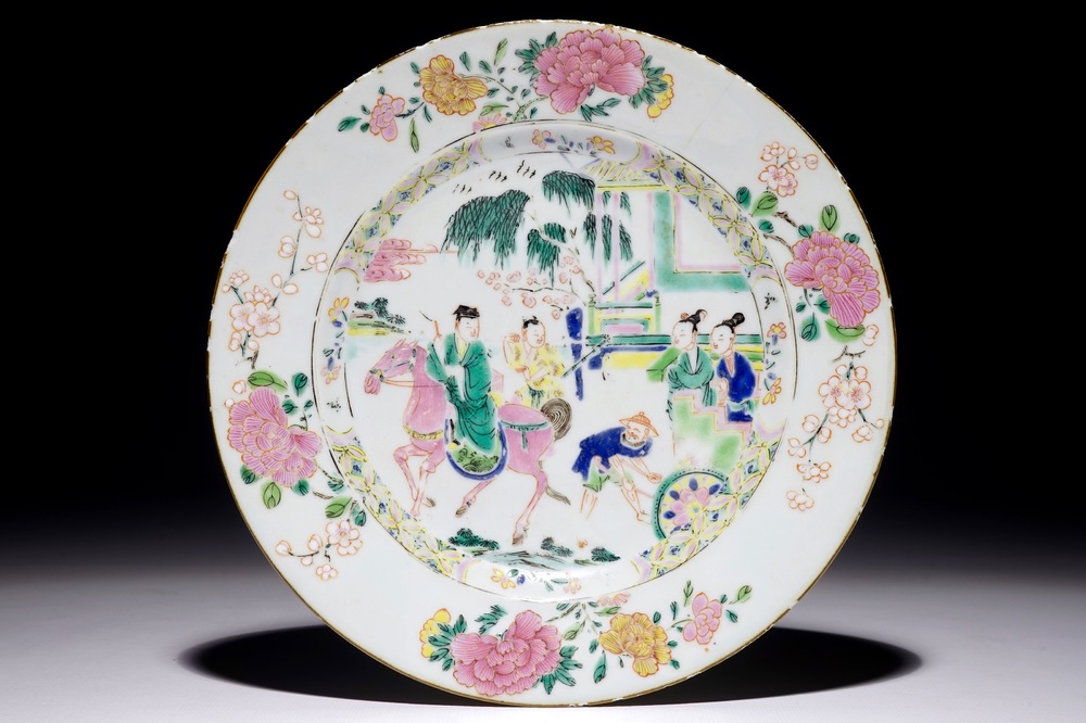 A Chinese famille rose plate with figures in a garden, Yongzheng