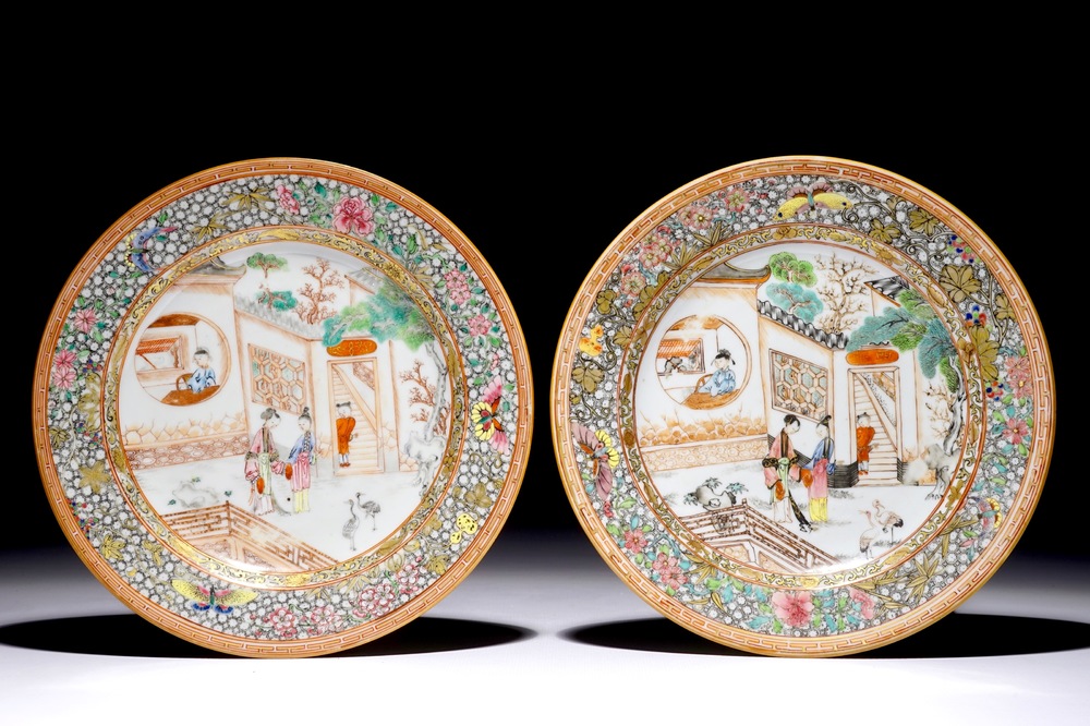A pair of Chinese famille rose plates with figures on a terrace, Yongzheng