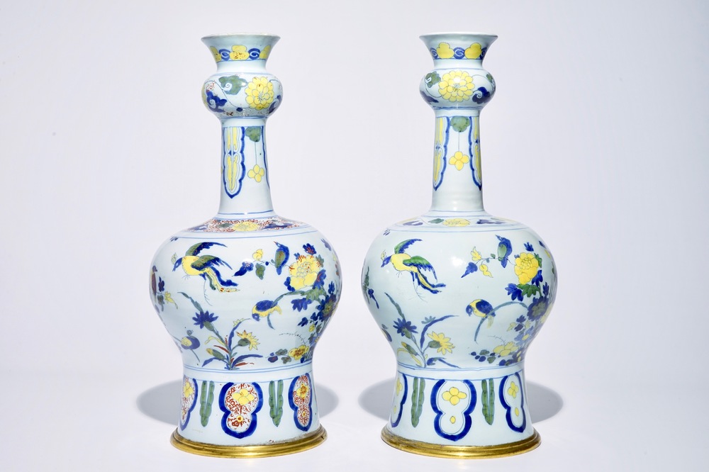 A pair of tall bronze-mounted polychrome Dutch Delft garlic-necked vases, late 17th C.