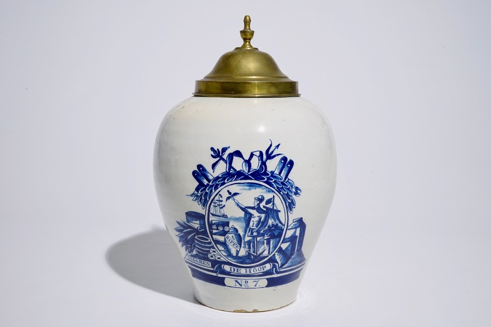An unusual Dutch Delft blue and white tobacco jar inscribed &quot;De Hoop&quot;, with brass cover, 18th C.
