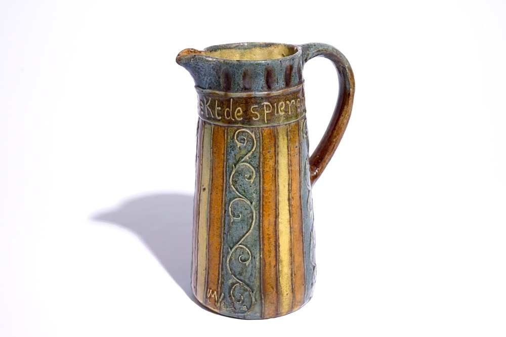 A Flemish pottery jug with proverbial inscription, signed LMV, Torhout, ca. 1900