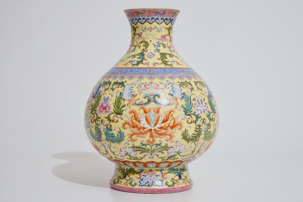 A Chinese famille rose on yellow sgraffiato ground vase in imperial Qianlong style, 20th C.