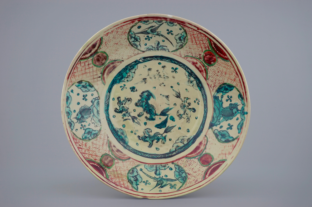 A Chinese Zhangzhou Swatow dish with buddhist lions, birds and fish, Ming