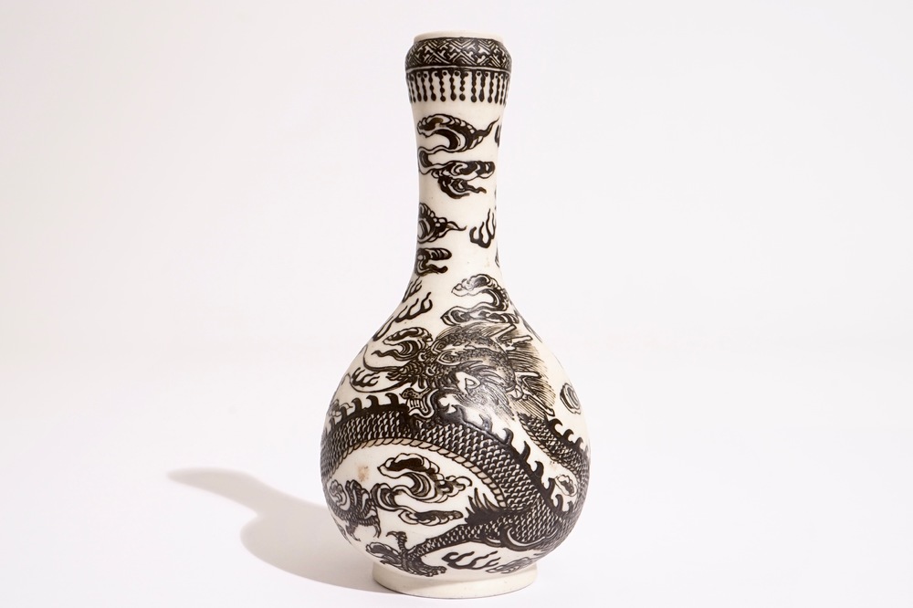 A Chinese black-enamelled biscuit porcelain &quot;dragon&quot; vase, Xuande mark, 18/19th C.